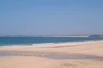On its journey between Hayle and St Ives the little seaside train stops at spectacular Carbis Bay.