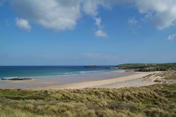 Miles of golden sands stretch between Hayle beach and Godrevy lighthouse, which marks the far end of St Ives Bay.