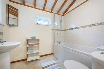 There is a step leading to the bathroom, which is located on the ground floor.