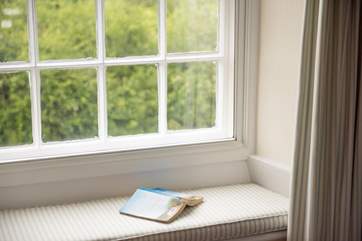 The window seat is a lovely spot to read a book.