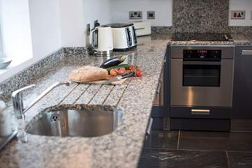 Prepare a gourmet meal in the well-equipped kitchen.