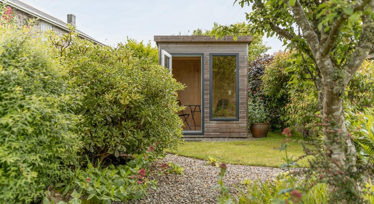 The garden has a lovely summer house.