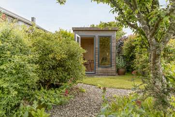 The garden has a lovely summer house.