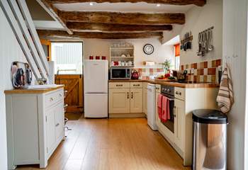 The kitchen benefits from the open plan layout as well as a stable door out to the very private rear garden. 