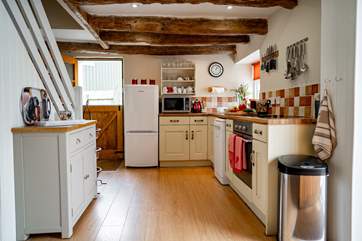 The kitchen benefits from the open plan layout as well as a stable door out to the very private rear garden.