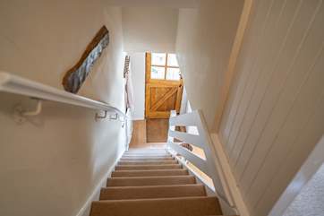 The stairs up to the bedrooms and bathroom.