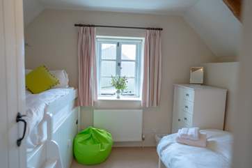 The twin bedroom offers two 3ft beds with space to play and relax.