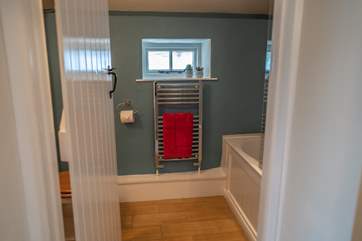 The bathroom is situated on the landing between the two bedrooms.
