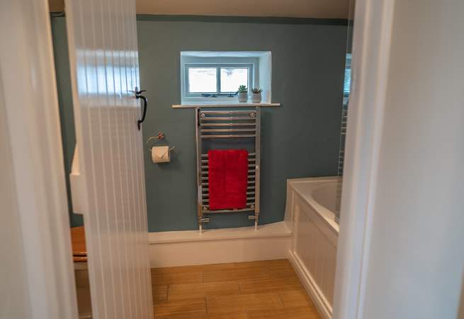 The bathroom is situated on the landing between the two bedrooms.