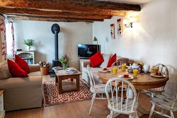 The open plan living makes for a wonderfully sociable holiday, in the winter months the wood burning stove will keep the cottage cosy.