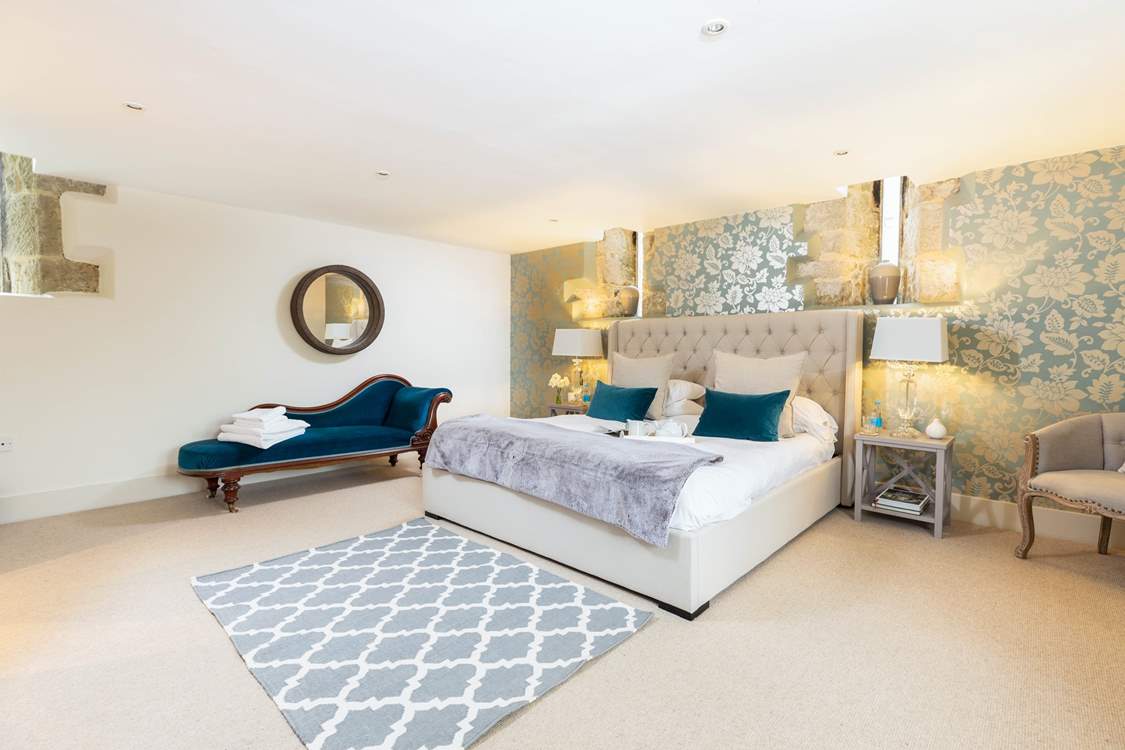 The spacious master bedroom has a comfy 6ft super-king double bed and an en suite shower-room.