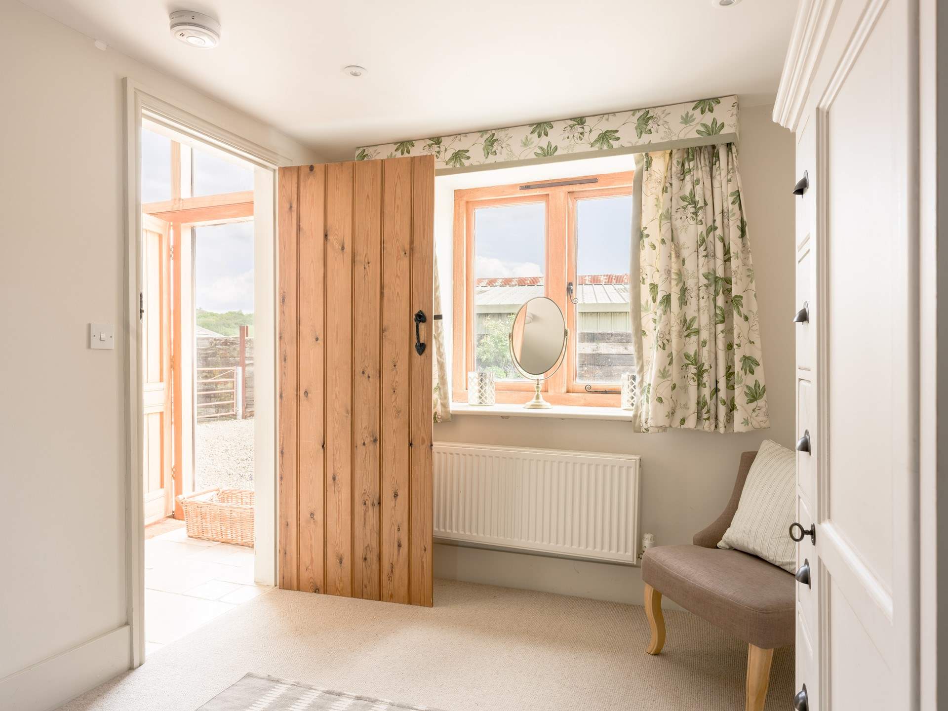 This lovely light second bedroom also has plenty of storage.