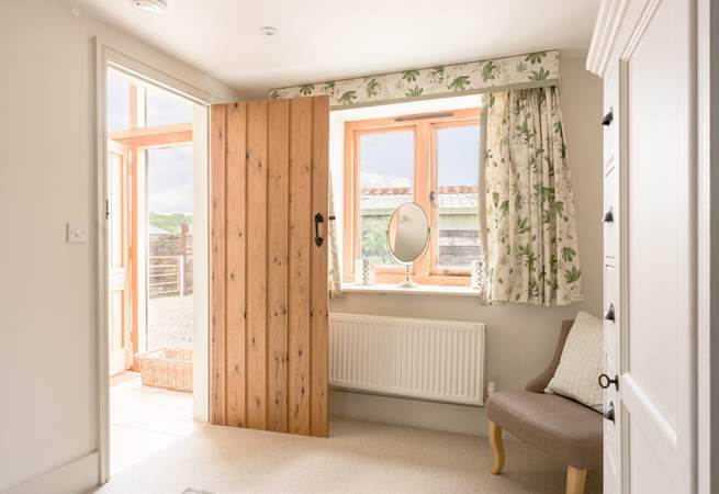 This lovely light second bedroom also has plenty of storage.
