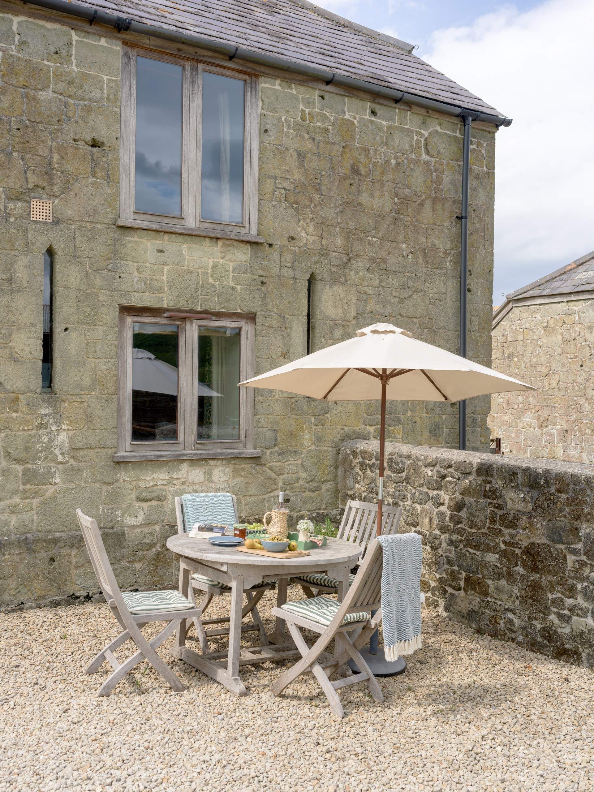 The pretty little outdoor seating area is tucked neatly in a sunny spot.