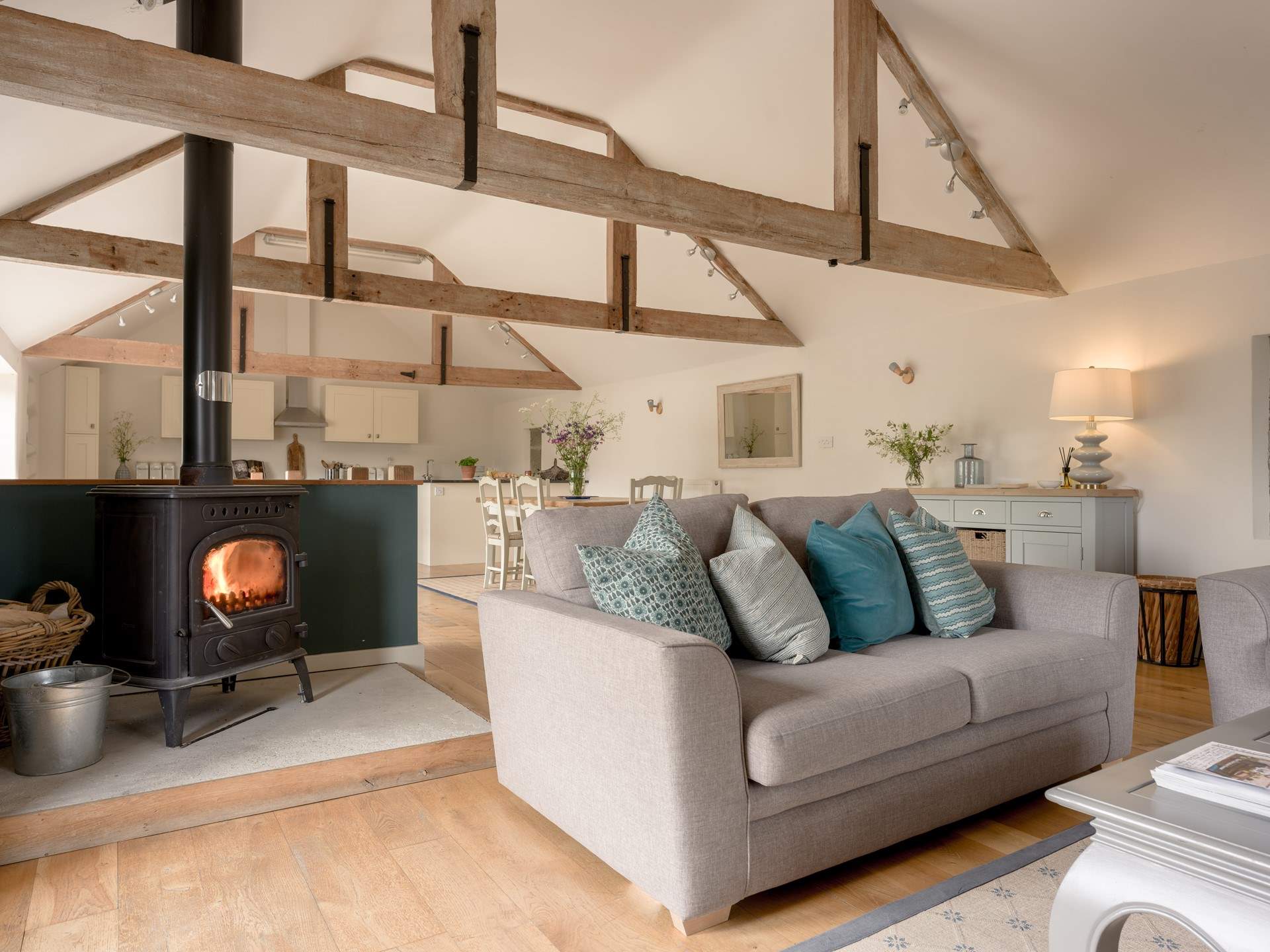 The living space is perfectly complimented by the wood burning stove to make things extra cosy in the colder months.