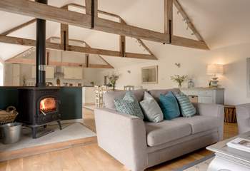 The living space is perfectly complimented by the wood burning stove to make things extra cosy in the colder months.