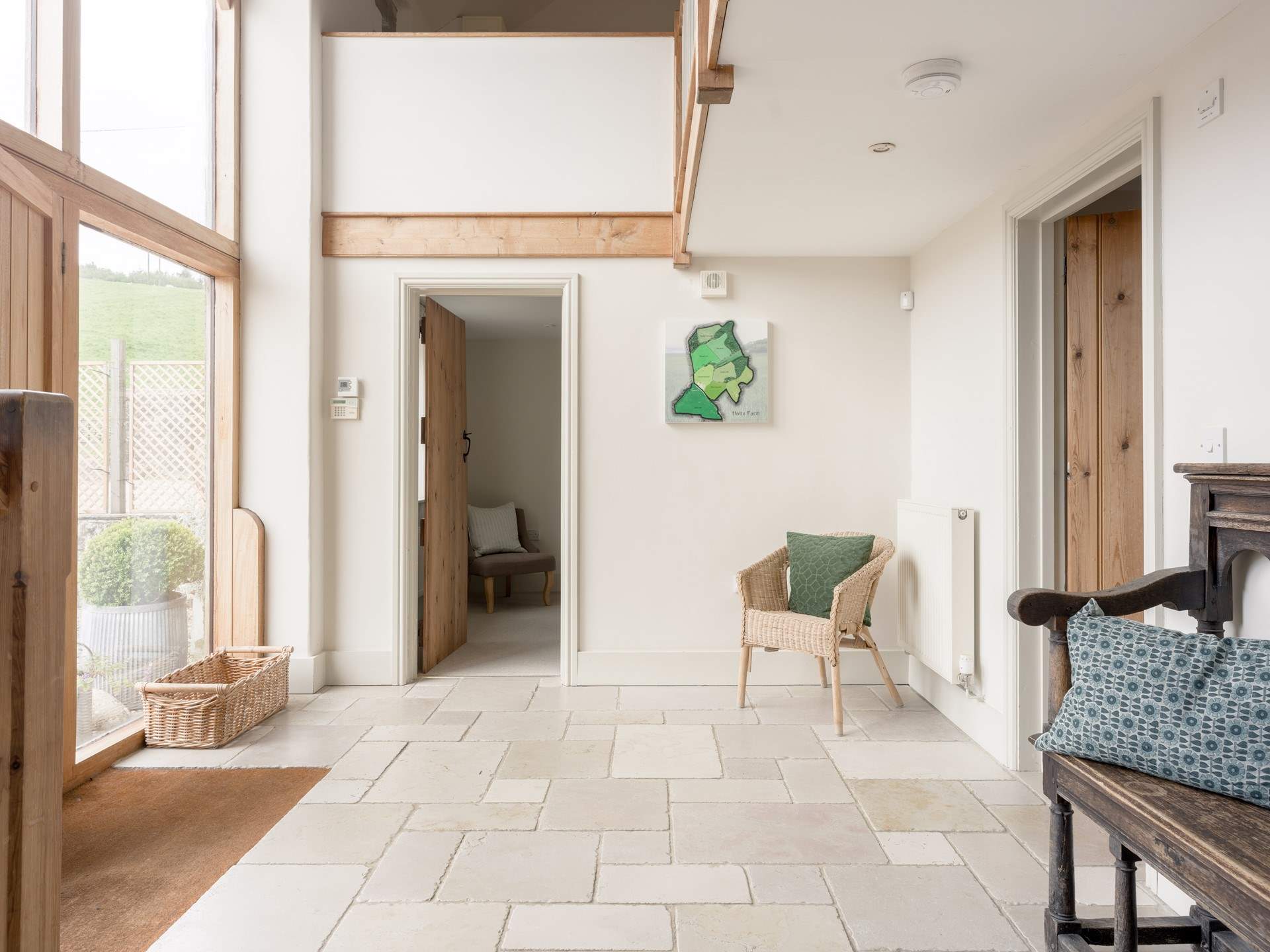 The grand entrance hall is a lovely example of the paired back styling in the barn.
