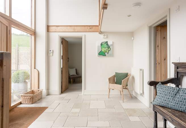 The grand entrance hall is a lovely example of the paired back styling in the barn.