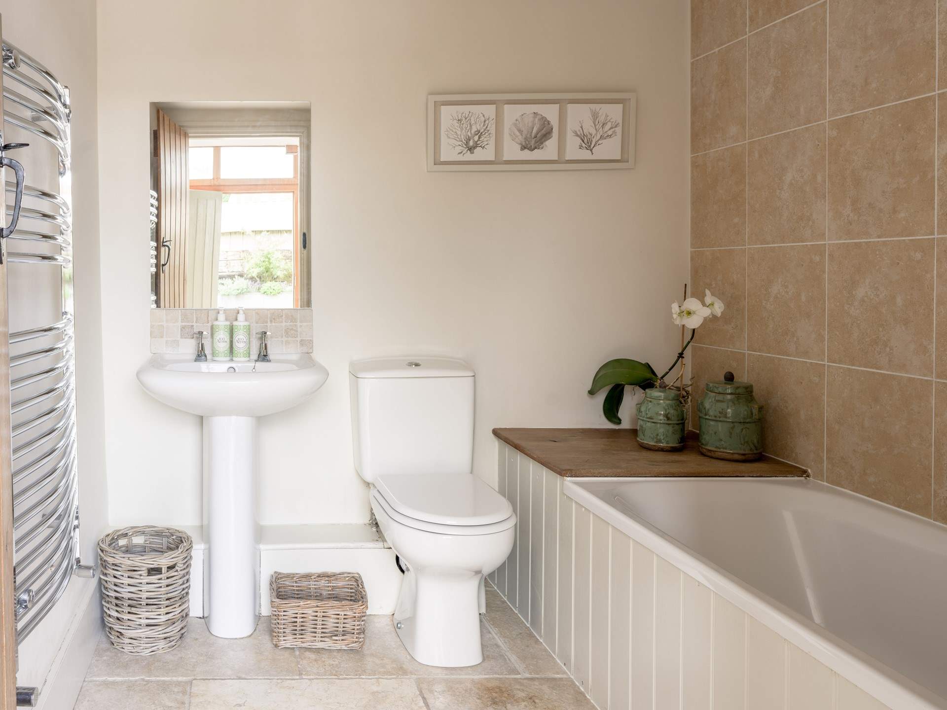 The family bathroom joins the two bedrooms on the ground floor.