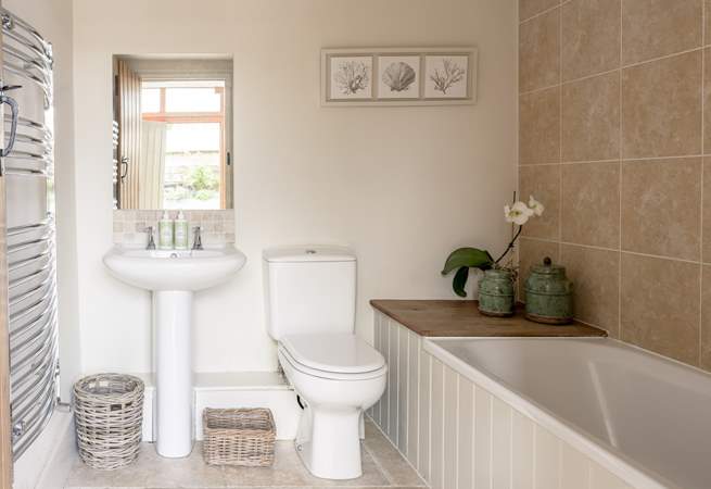 The family bathroom joins the two bedrooms on the ground floor.