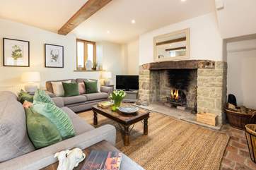 The open fire adds cosy character to this lovely cottage.
