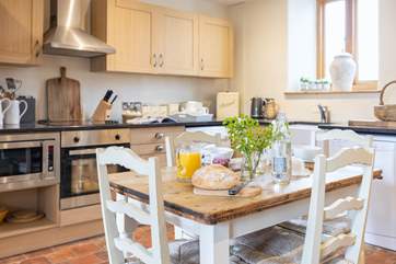 The dining table has plenty of space for the family.