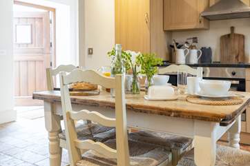 The dining table has plenty of space for the family.