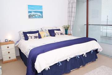The spacious master bedroom also has a balcony the full length of the room.
