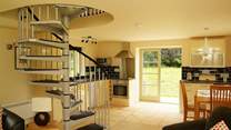 The open plan living-room allows light to pour in.