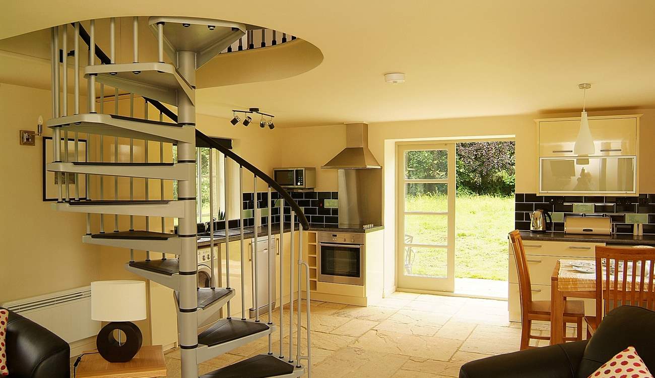 The open plan living-room allows light to pour in.