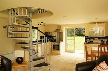 The open plan living-room allows light to pour in.