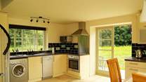 The kitchen-area is beautifully fitted along two of the walls of this unique space.