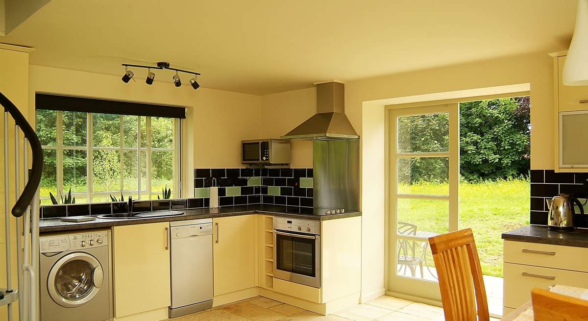 The kitchen-area is beautifully fitted along two of the walls of this unique space.