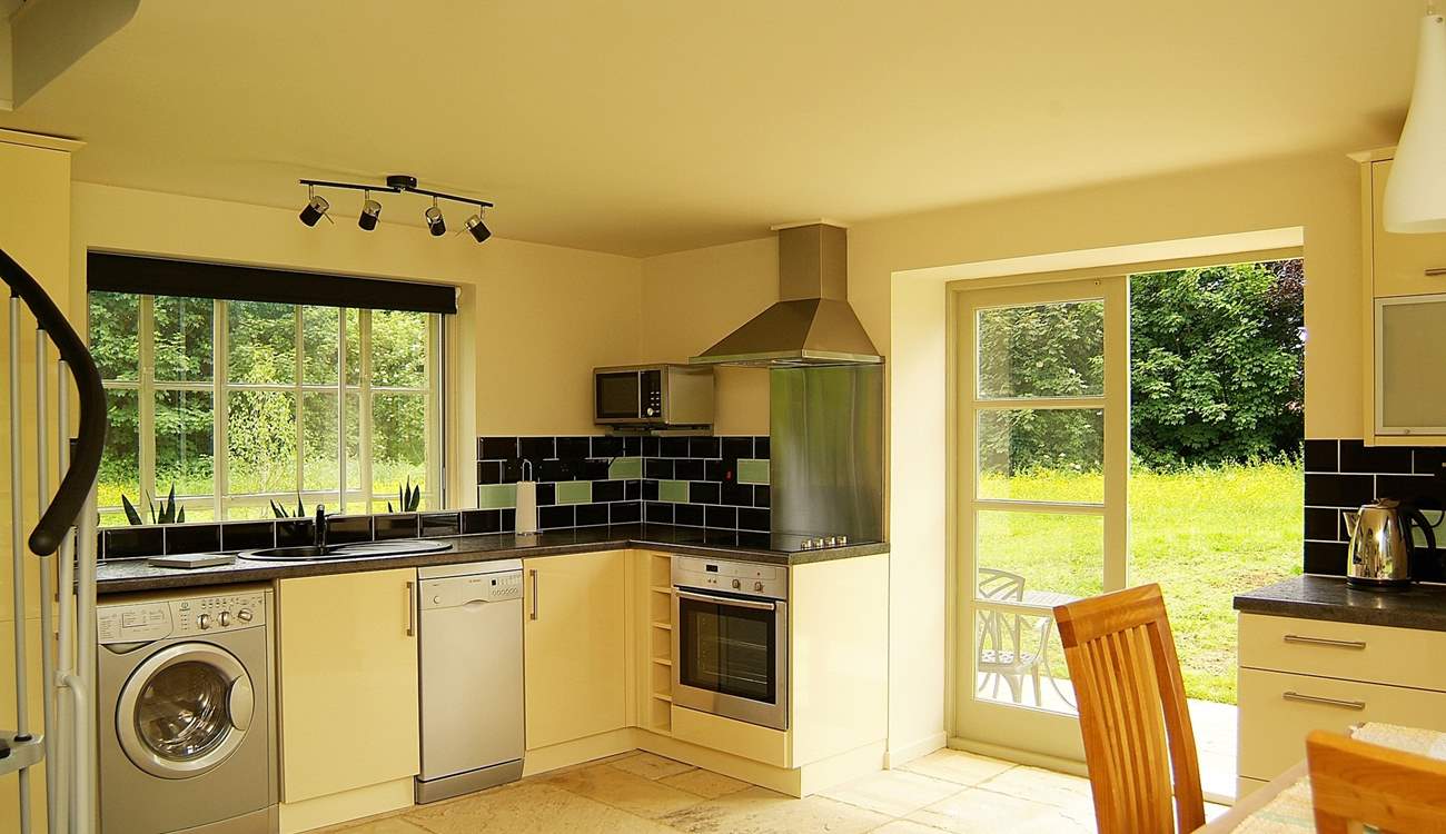 The kitchen-area is beautifully fitted along two of the walls of this unique space.
