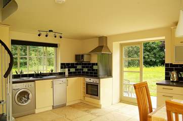 The kitchen-area is beautifully fitted along two of the walls of this unique space.