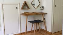 This cleverly designed dressing-table with storage and a make-up mirror is a great addition to the bedroom.