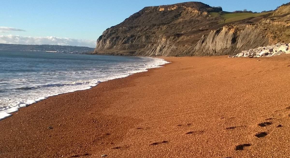 The iconic  Jurassic Coastal landmark of Golden Cap from the beach at Seatown. ( where there is a fabulous pub ! ).  Lyme Regis is in the distance