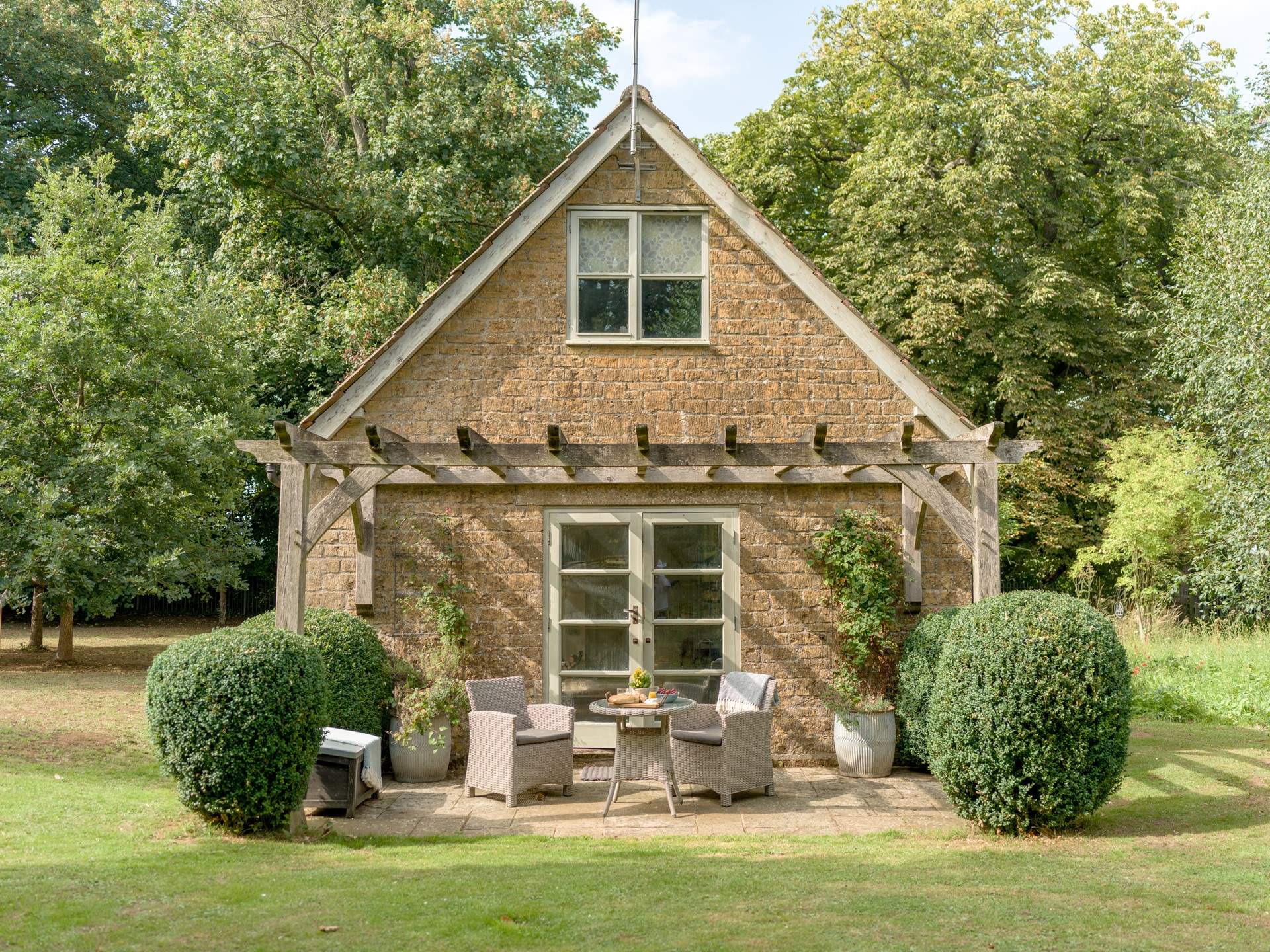 The rear of The Pump House provides a tranquil haven to while away the hours in the stunning gardens.