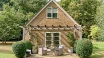 The rear of The Pump House provides a tranquil haven to while away the hours in the stunning gardens.