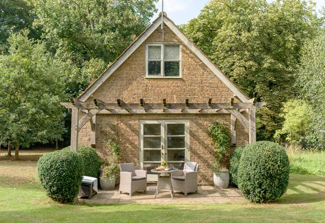 The rear of The Pump House provides a tranquil haven to while away the hours in the stunning gardens.