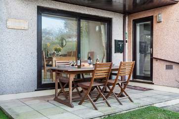 The sunny patio looks out to the communal garden.