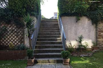 The steps that lead down from the car park to the apartment.