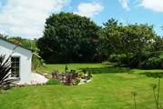 The large garden is beautifully maintained by the owners.