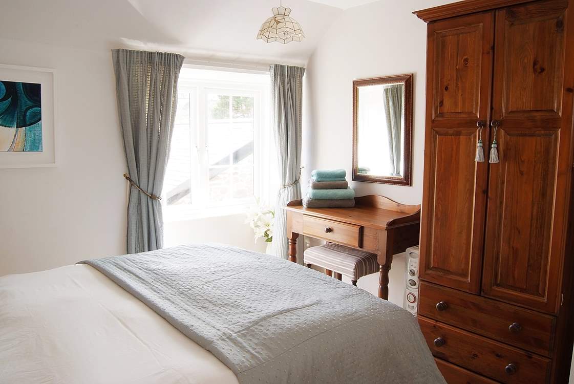 Classically elegant, this is the principal bedroom.