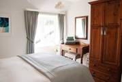 Classically elegant, this is the principal bedroom.