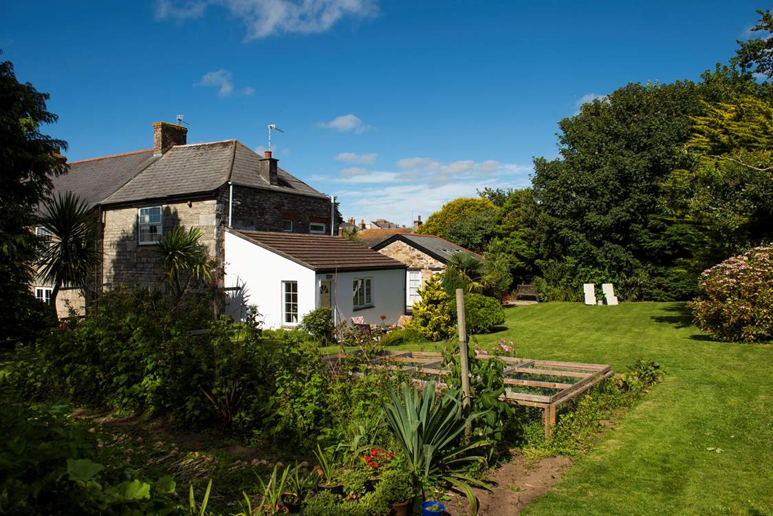 The well-maintained garden, full of colour and interest throughout the year.
