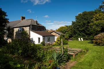 The well-maintained garden, full of colour and interest throughout the year.