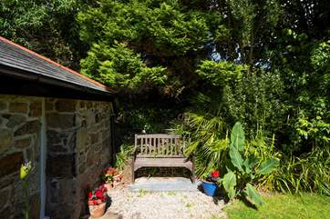 Relax on the garden bench with a morning coffee.