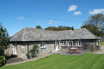 The rear of the cottage, showing the terrace and deck.