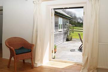 The patio doors lead straight out to the sun-drenched patio.